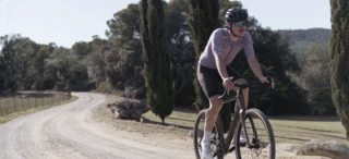 A man rides a gravel bike on a cycle path