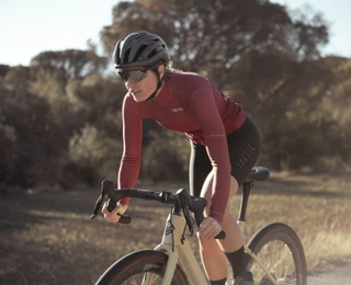 A woman riding a road bike