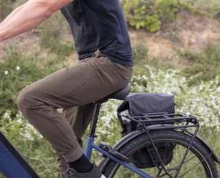 A man sitting on a touring bike