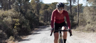 A woman riding a road bike